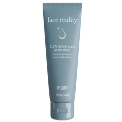 Tube of 'face reality' acne medication on a white background
