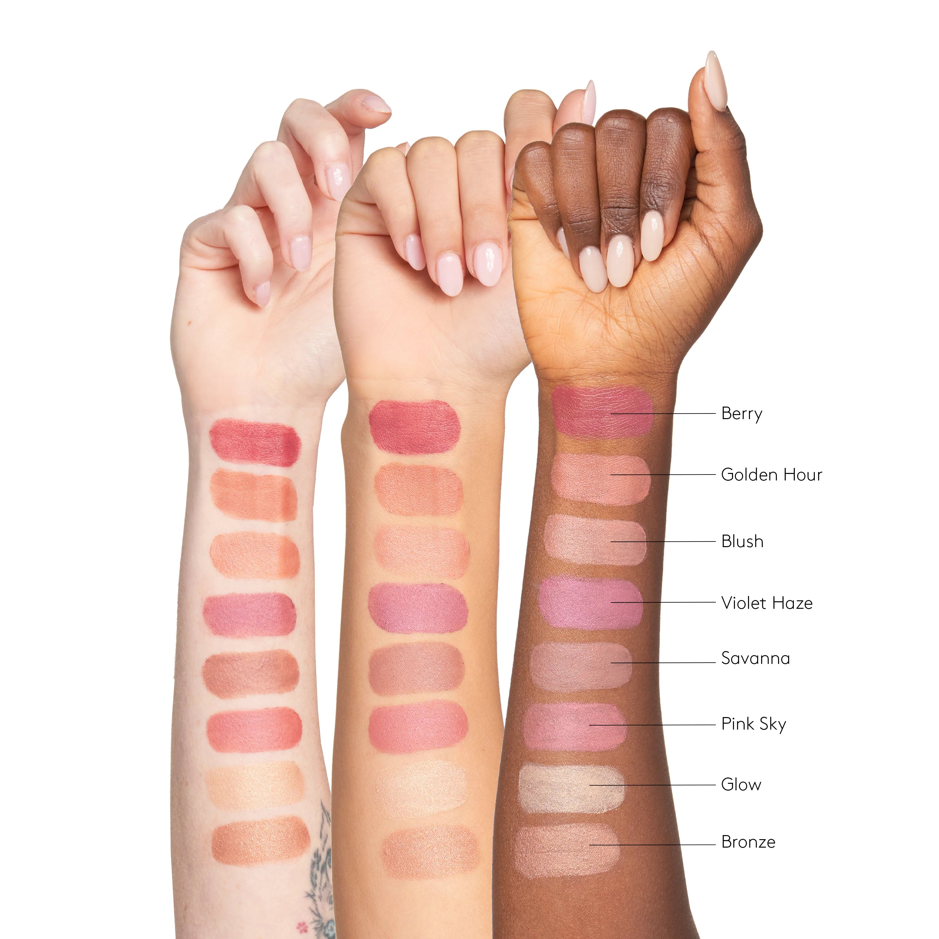 Three hands with swatches of different lip colors on a white background