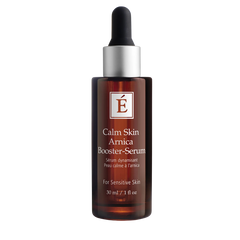 A bottle of Eminence Calm Skin Arnica Booster-Serum with a dropper, labeled for sensitive skin.