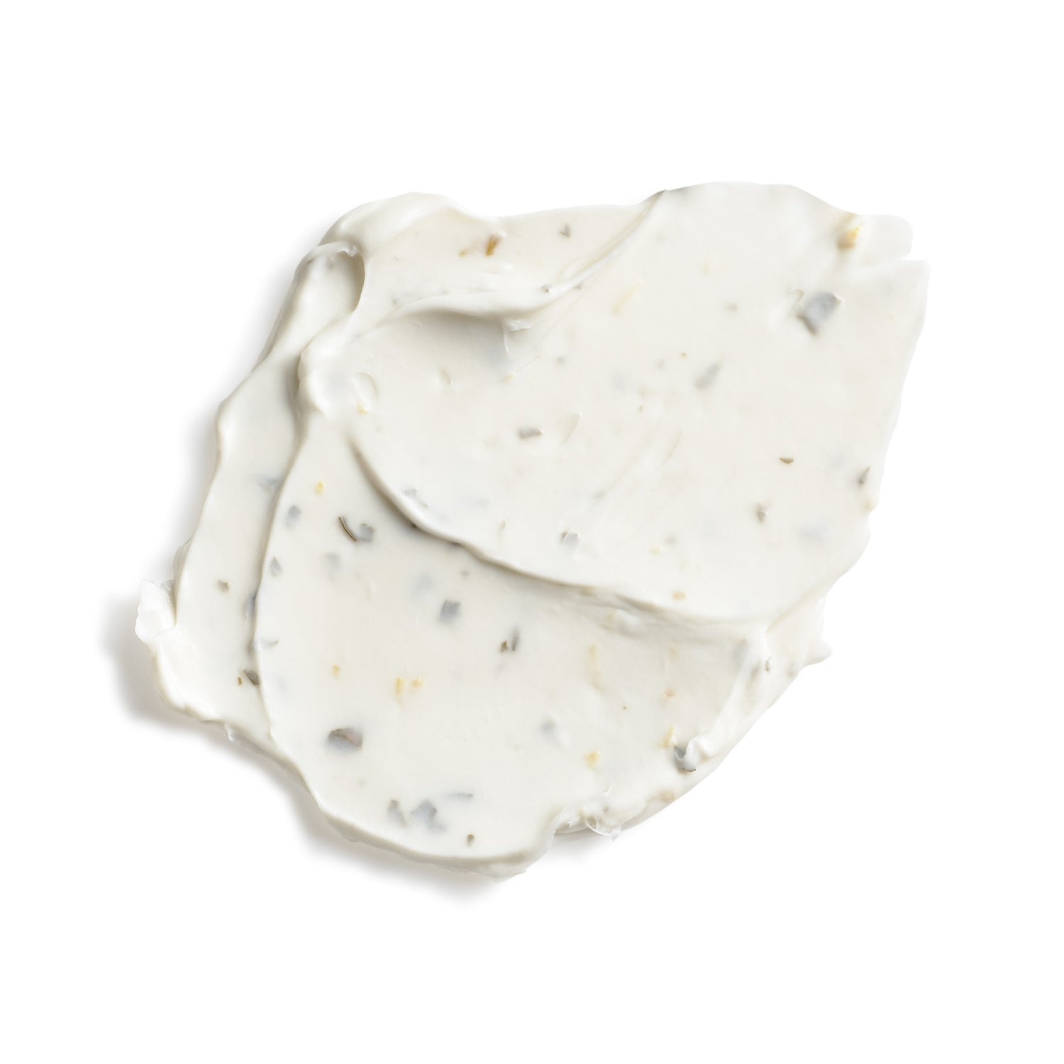 White cream with specks on a white background