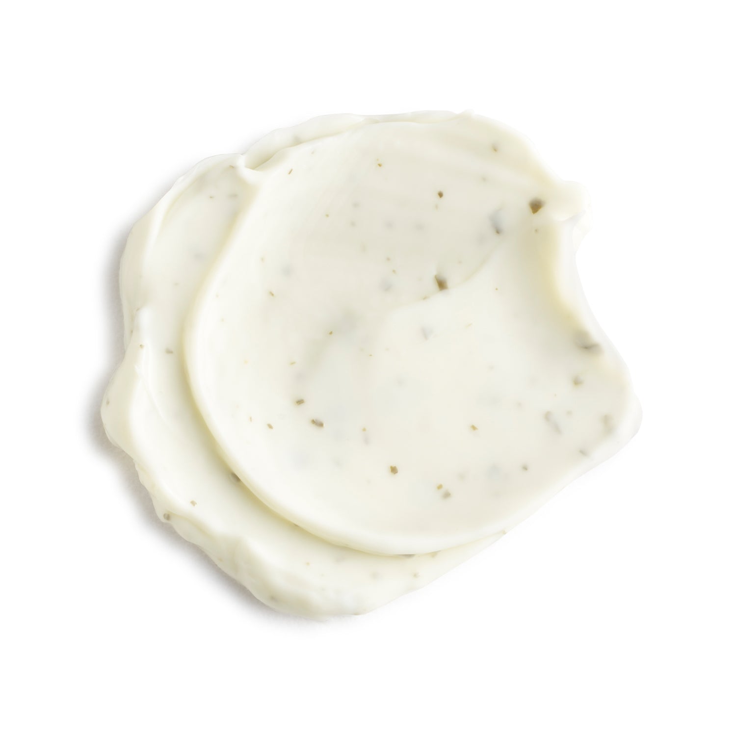 Two swatches of white cream on a light beige background