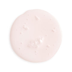 Pink cream or gel on a white background