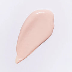 Beige cosmetic cream swatch on a light gray background