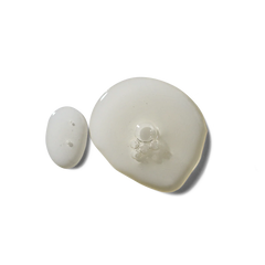 Two white ceramic items on a white background