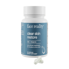 Supplement bottle labeled 'face reality clear skin restore' on a white background