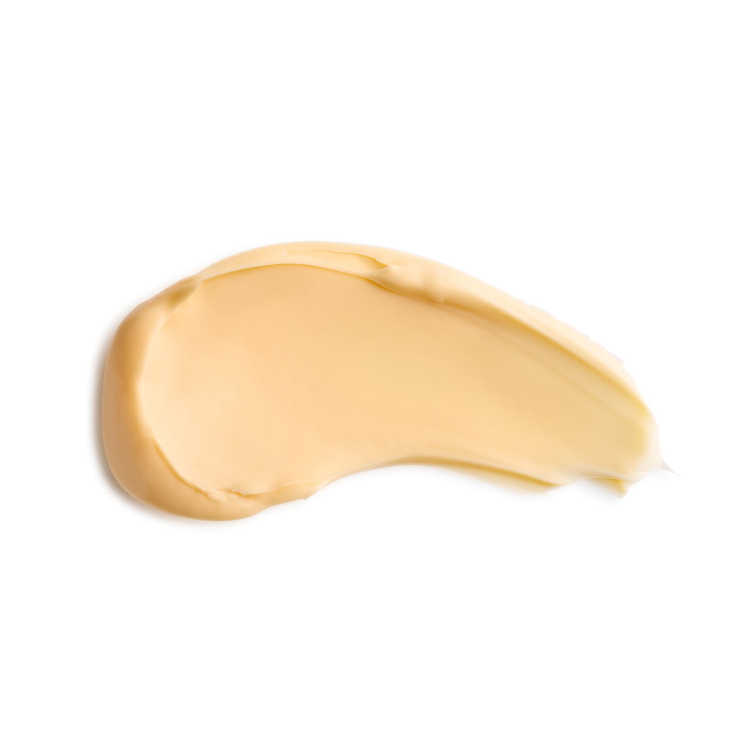 Gold-colored cream swatch on a white background