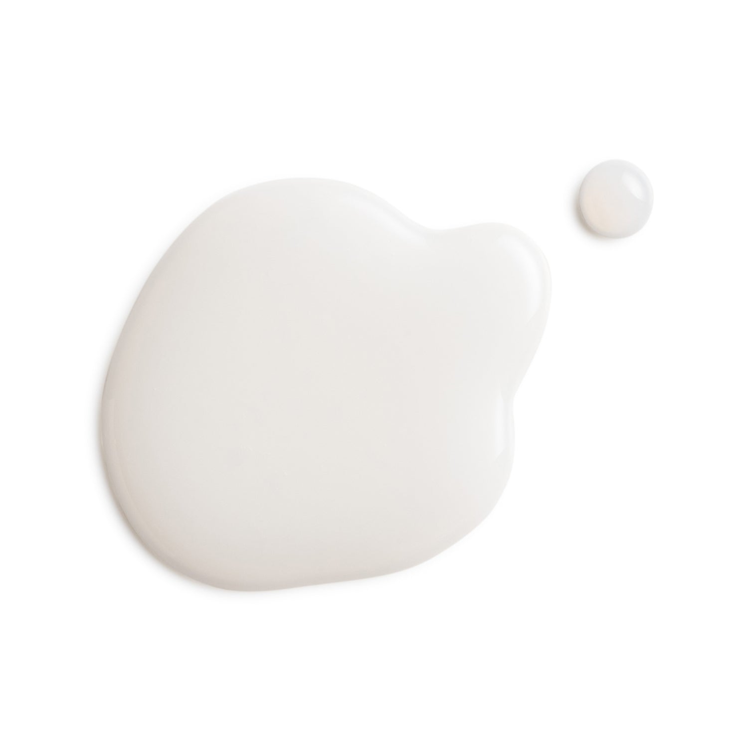 Two white blobs of cream on a white background