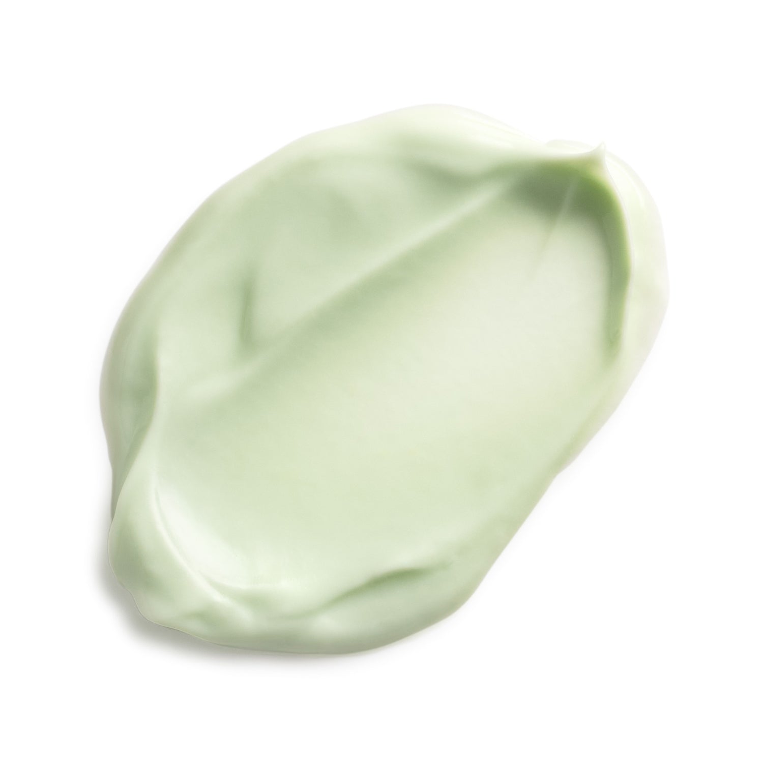 Green smear of cream on a white background
