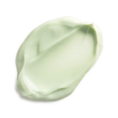 Green smear of cream on a white background