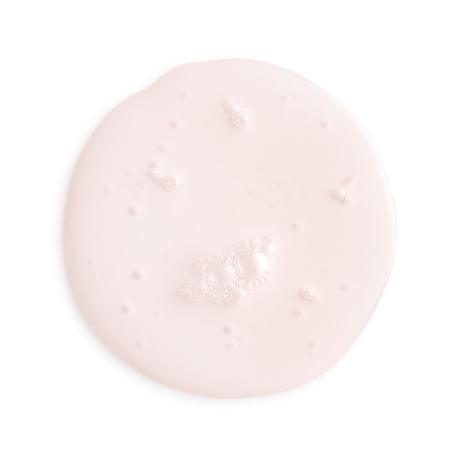 Pink cream or gel on a white background