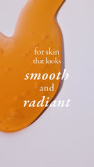 Orange skin care tool with text 'for skin that looks smooth and radiant' on a light gray background