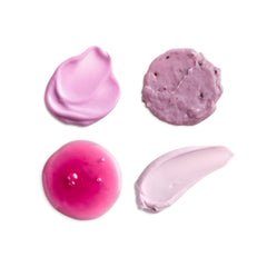 Four different textures of pink and purple cream on a white background