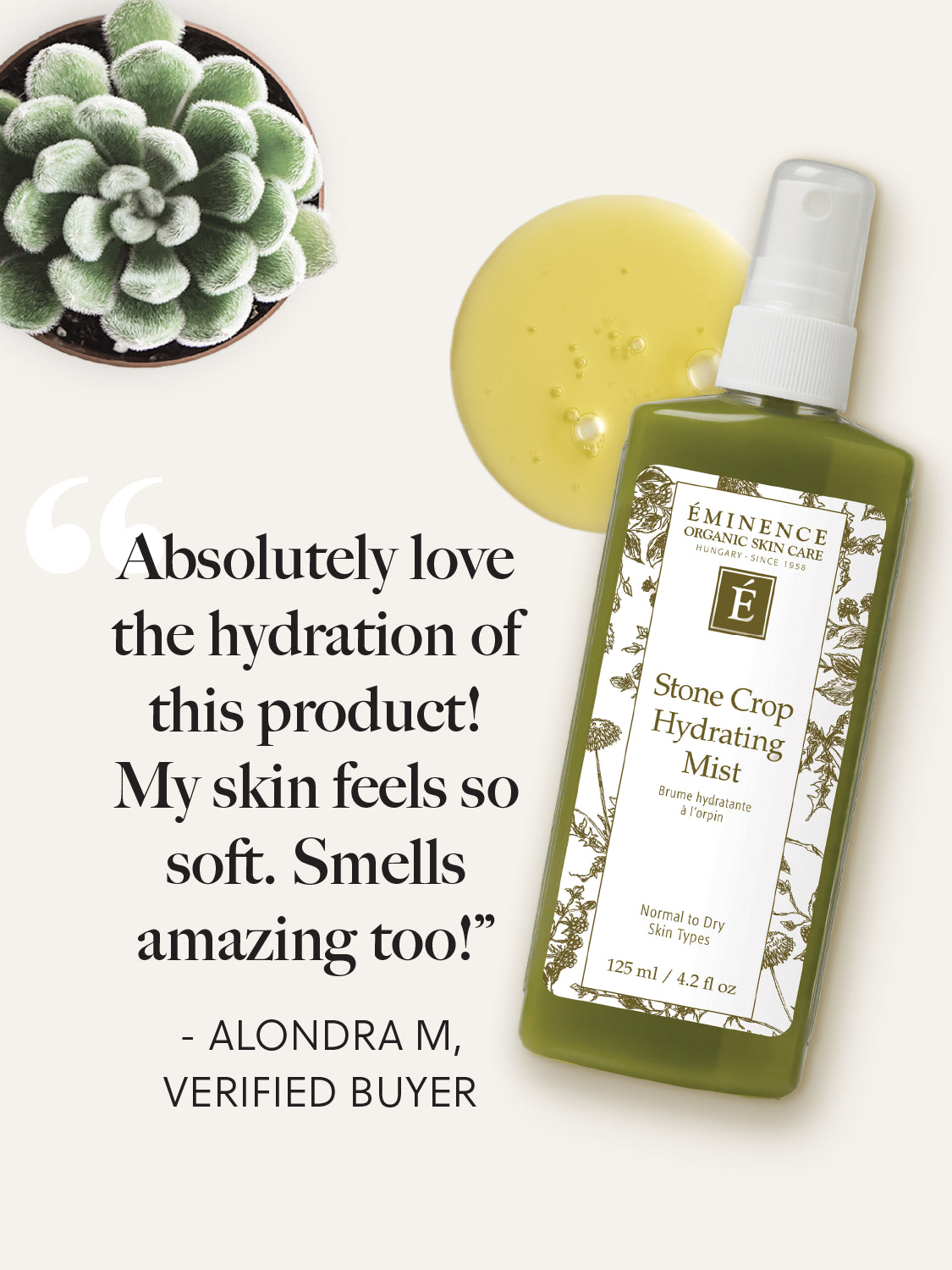 Green bottle of Eminence Stone Crop Hydrating Mist with a yellow oil blob and succulent plant on a white background.