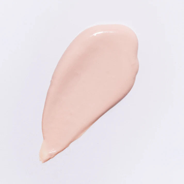 Beige cosmetic cream swatch on a light gray background