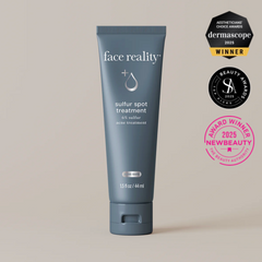 Tube of 'face reality' sulfur spot treatment with awards on a beige background