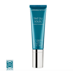 Blue cosmetic tube labeled 'Tint Du Soleil' on a white background