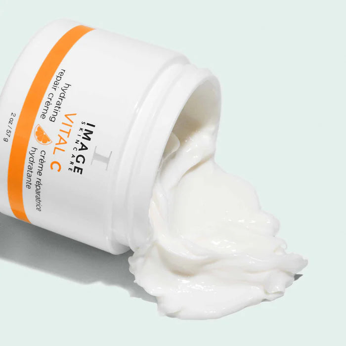 Open jar of IMAGE Skincare Vital C cream with a light gray background