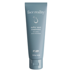 Tube of 'face reality' sulfur spot treatment on a white background